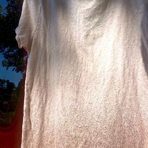 Off white with pinkish gold tones.  American Eagle Xl.